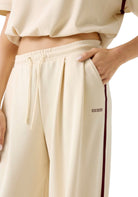 PANTALONI Panna/bordeaux Guess